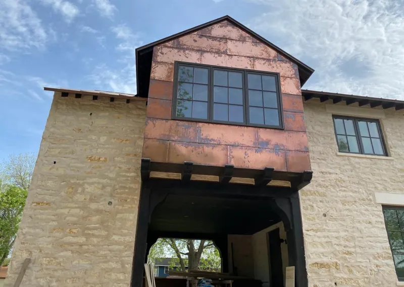 Copper metal panel facade on a stone building for Skylight Installation in Oceanport